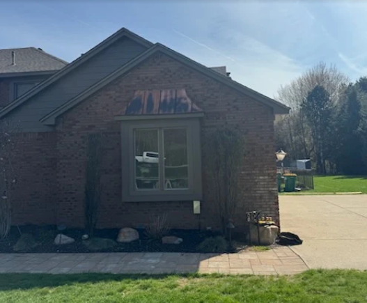 Brick home exterior with a professionally replaced front window